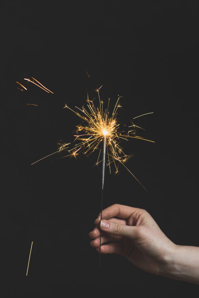 new-year-concept-with-hand-holding-sparkler