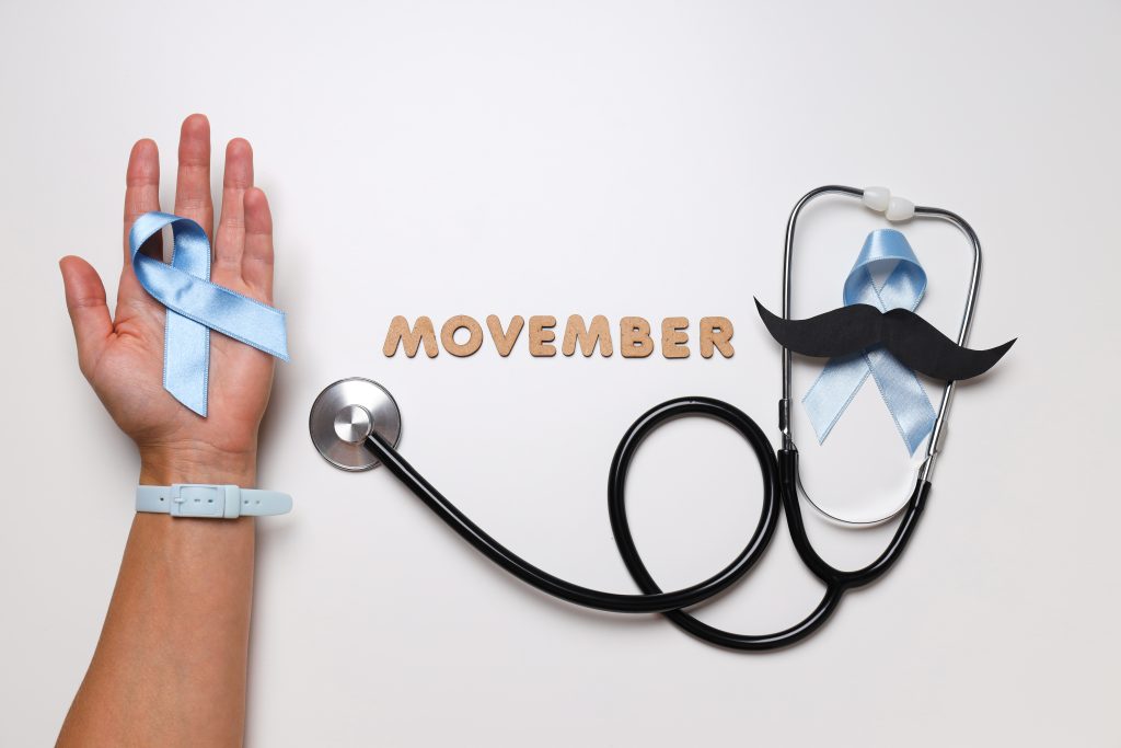 Stethoscope with paper mustache and blue ribbon, Movember concept